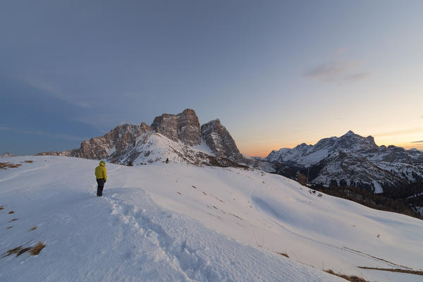 Hiker in front of Pelmo and Civetta from Col Roàn, Dolomites, Fiorentina Valley, Belluno, Borca di Cadore, Belluno, Veneto, Italy