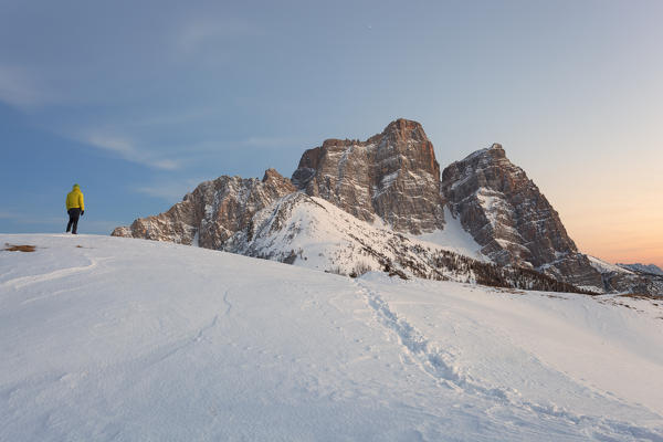 Hiker in front of Pelmo from Col Roàn, Dolomites, Fiorentina Valley, Belluno, Borca di Cadore, Belluno, Veneto, Italy