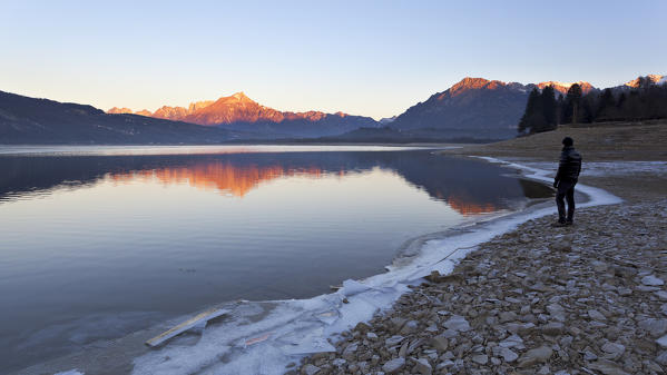 Dawn at Santa Croce Lake, Alpago, Belluno Prealps, Farra d'Alpago, Belluno province, Veneto, Italy.