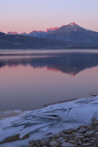 Dawn at Santa Croce Lake, Alpago, Belluno Prealps, Veneto, Italy.