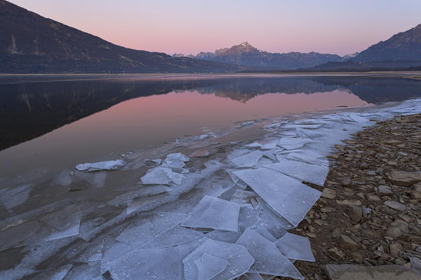 Dawn at Santa Croce Lake, Alpago, Belluno Prealps, Veneto, Italy.