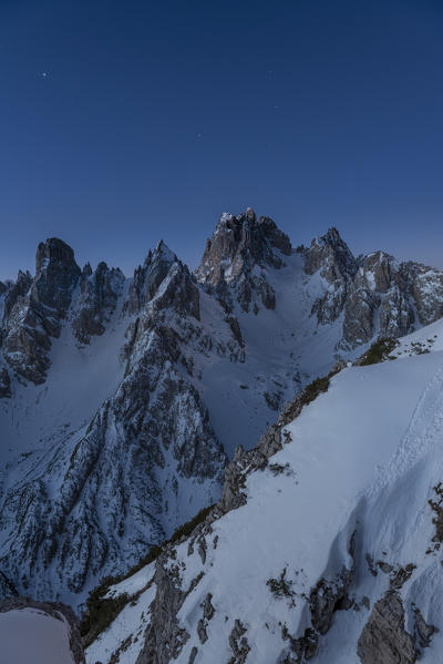 Mount Campedelle, Misurina, Auronzo di Cadore, province of Belluno, Veneto, Italy, Europe. Full moon night over the Cadini mountains