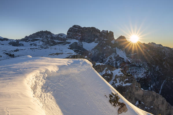 Mount Campedelle, Misurina, Auronzo di Cadore, province of Belluno, Veneto, Italy, Europe. The sun rises behind the Croda dei Toni