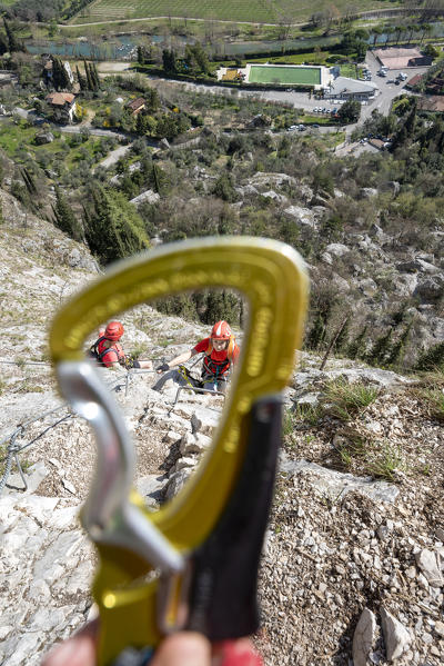 Arco, Trento province, Trentino, Italy. Climber on the via ferrata Colodri