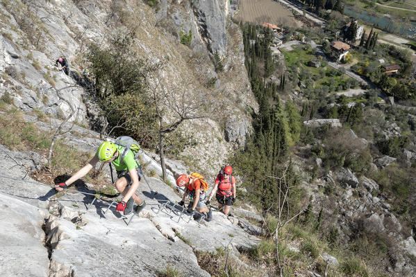 Arco, Trento province, Trentino, Italy. Climber on the via ferrata Colodri