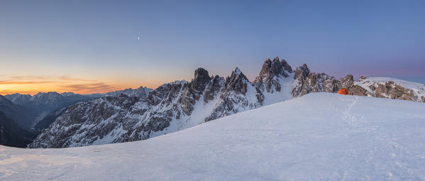 Mount Campedelle, Misurina, Auronzo di Cadore, province of Belluno, Veneto, Italy, Europe. Sunrise over the Ansiei valley with the village of Auronzo and the Cadini di Misurina mountains