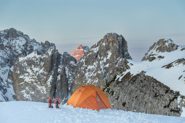 Mount Campedelle, Misurina, Auronzo di Cadore, province of Belluno, Veneto, Italy, Europe. Sunrise in the Cadini di Misurina mountains, the Punta Sorapiss is illuminated by the first sunlight