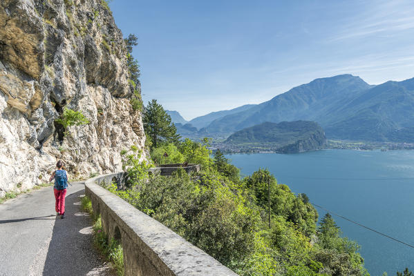 Pregasina, Riva del Garda, Lake Garda, Trento province, Trentino Alto Adige, Italy, Europe. Hiker on the on the old Ponale Road