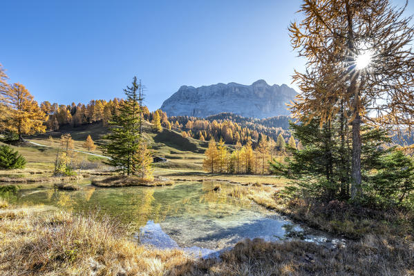 Alta Badia, Bolzano province, South Tyrol, Italy, Europe. Autumn on the Armentara meadows, above the mountains of the Zehner and Heiligkreuzkofel