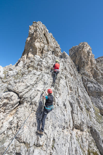 Cir, Dolomites, South Tyrol, Italy. Climbers on the via ferrata of Cir V