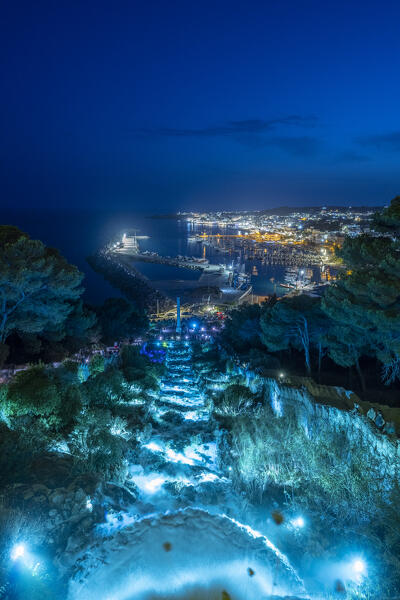 Castrignano del Capo, Santa Maria di Leuca, Salento, Apulia, Italy. The illuminated monumental waterfall of Santa Maria di Leuca