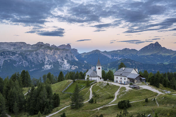 Alta Badia, Bolzano province, South Tyrol, Italy, Europe.  The pilgrimage church La Crusc and the La Crusc refuge at sunrise