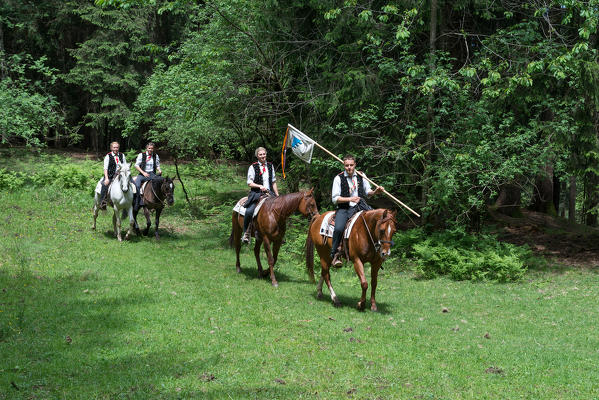 Fie, South Tyrol, Italy. The riders in the woods near Lake Fie