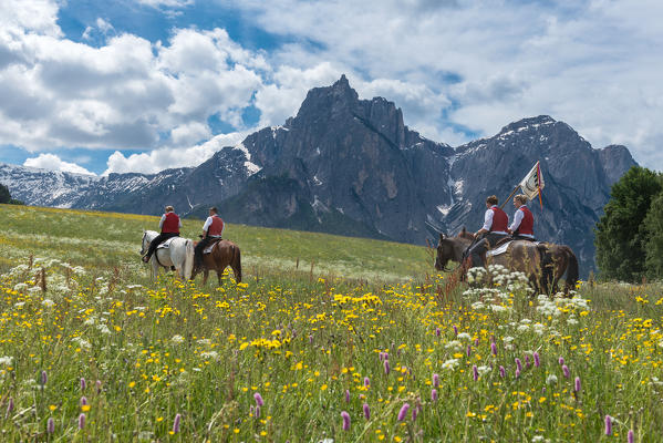 Castelrotto, South Tyrol, Italy. The riders in the fields above Castelrotto. In the background the Mount Sciliar