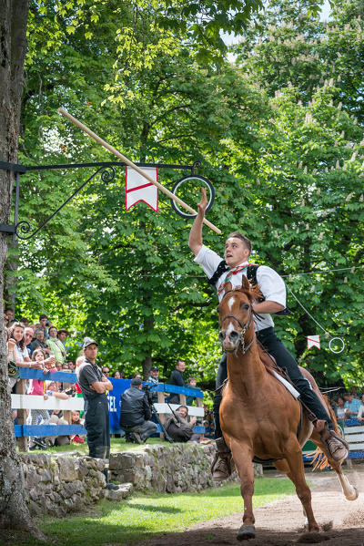 Castelrotto, South Tyrol, Italy. The traditional ring jousting at the Monte Calvario