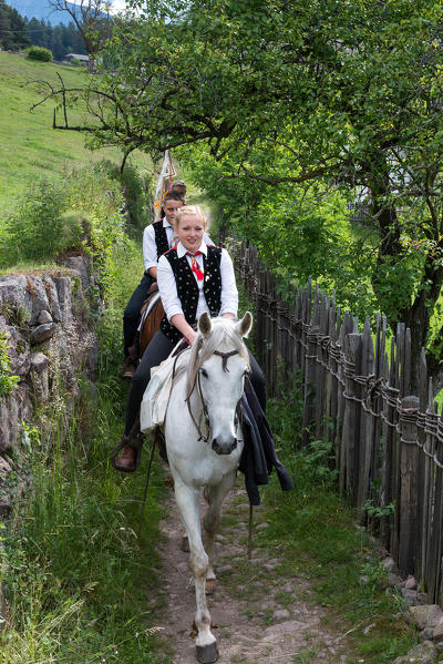 Castelrotto, South Tyrol, Italy. The riders are soon reachig Castelrotto and the Monte Calvario