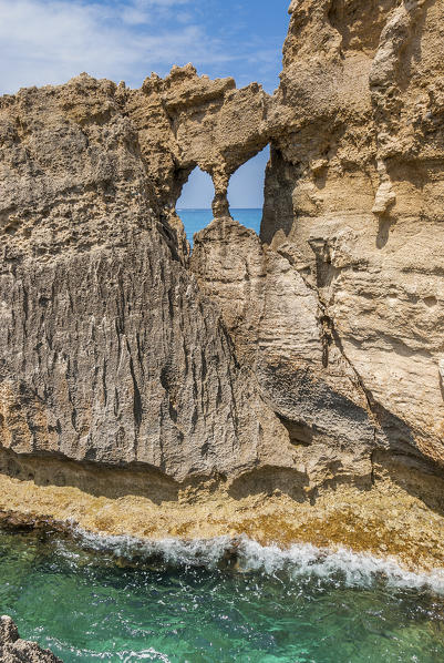 Riaci, Calabria, Italy. Window in the cliffs on the beach at Riaci