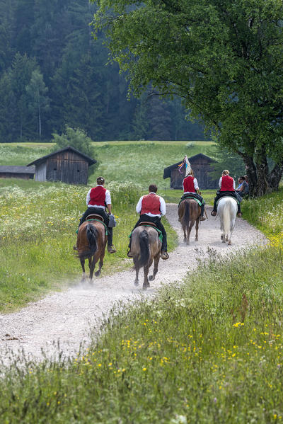 Castelrotto, South Tyrol, Italy. The riders in the fields above Castelrotto