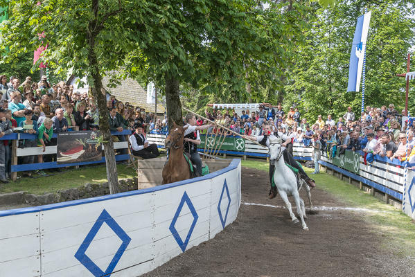 Castelrotto, South Tyrol, Italy. The traditional ring jousting at the Monte Calvario in Castelrotto 