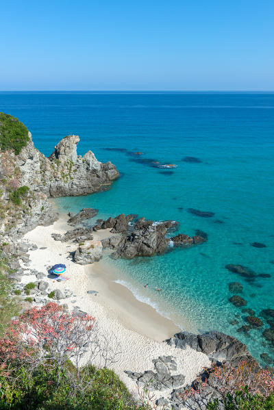 Zambrone, Vibo Valentia, Calabria, Italy. The beach of Capo Cozzo in Zambrone. To the left the rock in the form of a lion, called Lion Rock