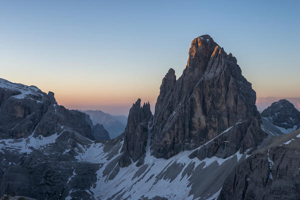 Sesto/Sexten, Dolomites, South Tyrol, Italy. The first sun rays touch the summit of the Croda dei Toni