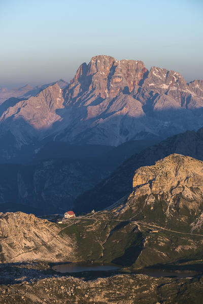 Sesto/Sexten, Dolomites, South Tyrol, Italy. First sunlight at Refuge Locatelli alle Tre Cime. In the background the Croda Rossa/Hohe Gaisl