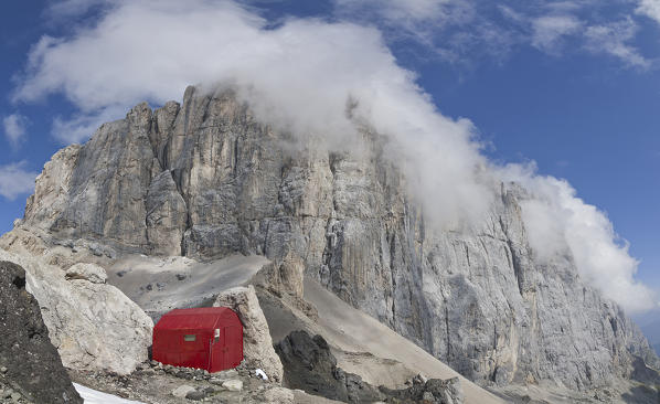 Marmolada, Dolomites, Veneto, Trentino, Italy. The bivouac Dal Bianco with the famous southface of Marmolada.