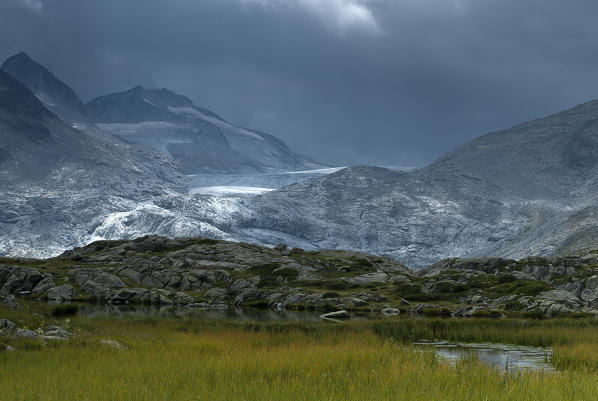 Pinzolo, Adamello, Trentino, Italy. Rain comes over the  Mandrone glacier