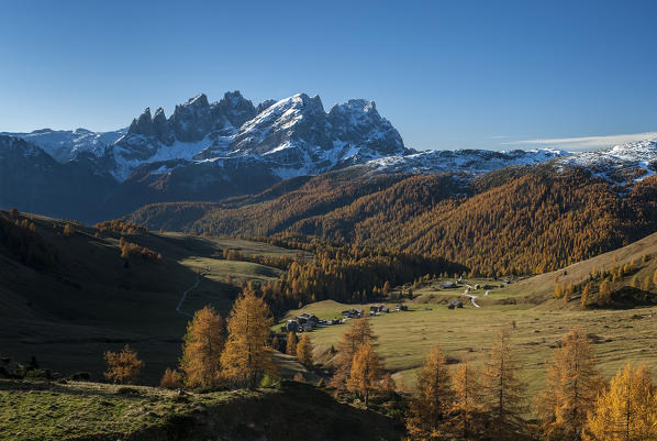 Fuciade, Dolomites, Trentino, Italy. Autumn at Fuciade. In the background the peaks of Pala di San Martino.