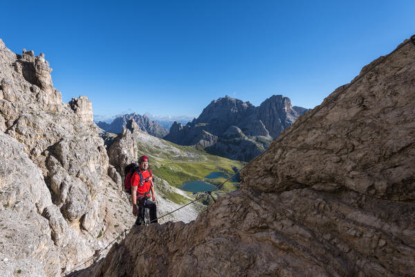 Sesto/Sexten, Dolomites, South Tyrol, province of Bolzano, Italy. Climber on the via ferrata De Luca-Innerkofler to the summit of Monte Paterno