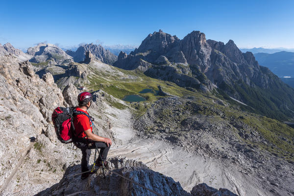 Sesto/Sexten, Dolomites, South Tyrol, province of Bolzano, Italy. Climber on the via ferrata De Luca-Innerkofler to the summit of Monte Paterno