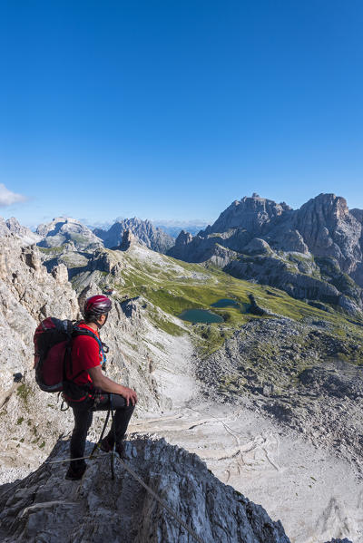 Sesto/Sexten, Dolomites, South Tyrol, province of Bolzano, Italy. Climber on the via ferrata De Luca-Innerkofler to the summit of Monte Paterno