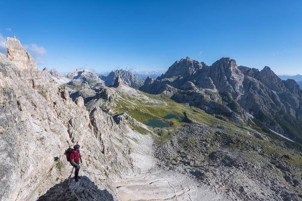 Sesto/Sexten, Dolomites, South Tyrol, province of Bolzano, Italy. Climber on the via ferrata De Luca-Innerkofler to the summit of Monte Paterno