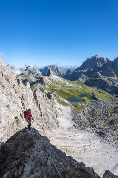 Sesto/Sexten, Dolomites, South Tyrol, province of Bolzano, Italy. Climber on the via ferrata De Luca-Innerkofler to the summit of Monte Paterno