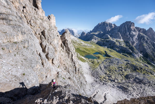 Sesto/Sexten, Dolomites, South Tyrol, province of Bolzano, Italy. Climber on the via ferrata De Luca-Innerkofler to the summit of Monte Paterno