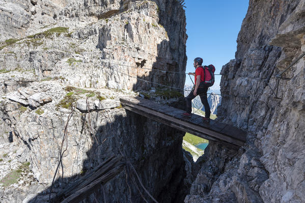 Sesto/Sexten, Dolomites, South Tyrol, province of Bolzano, Italy. Climber on the via ferrata 