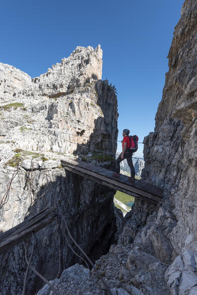 Sesto/Sexten, Dolomites, South Tyrol, province of Bolzano, Italy. Climber on the via ferrata 