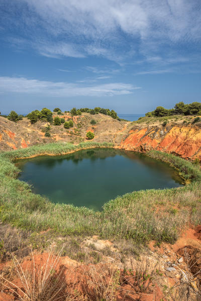 Otranto, province of Lecce, Salento, Apulia, Italy. Abandonet Bauxite Mine with green Lake