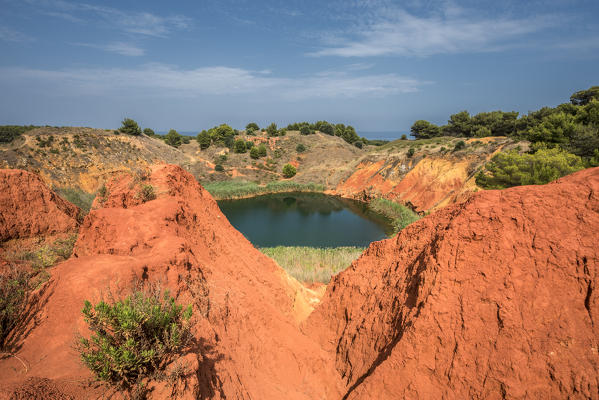 Otranto, province of Lecce, Salento, Apulia, Italy. Abandonet Bauxite Mine with green Lake