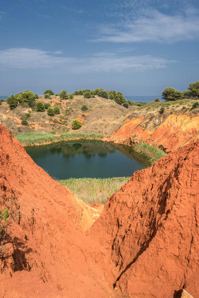 Otranto, province of Lecce, Salento, Apulia, Italy. Abandonet Bauxite Mine with green Lake