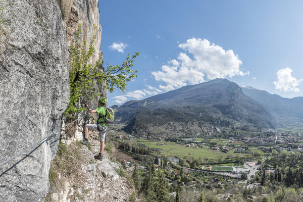 Arco, Trento province, Trentino, Italy. Climber on the via ferrata Colodri