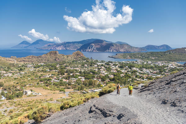 Volcano, Messina district, Sicily, Italy, Europe. Hikers on descent from Vulcano crater