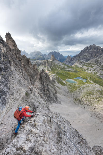 Sesto / Sexten, province of Bolzano, Dolomites, South Tyrol, Italy. Climber on the via ferrata 