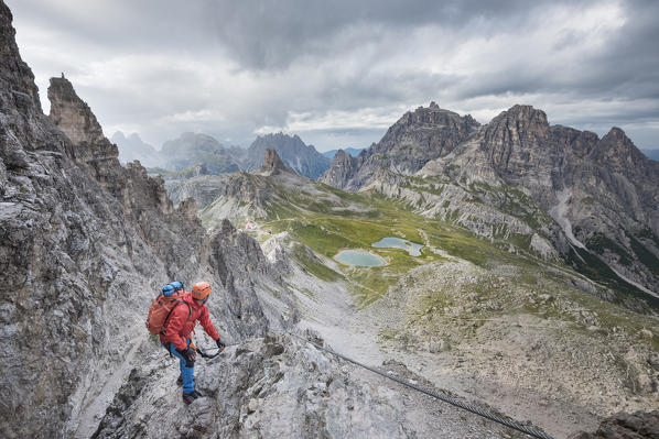 Sesto / Sexten, province of Bolzano, Dolomites, South Tyrol, Italy. Climber on the via ferrata 