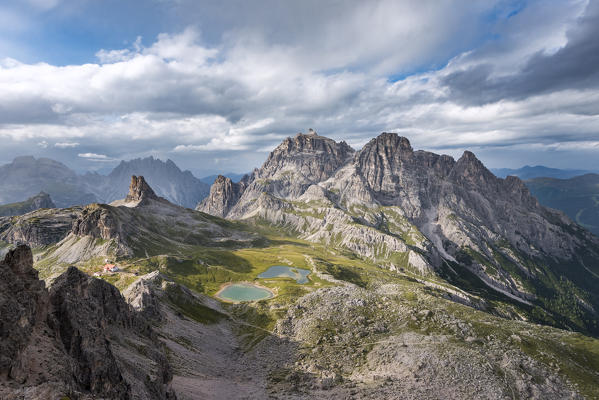 Sesto / Sexten, province of Bolzano, Dolomites, South Tyrol, Italy. Zhe sunrays after the thunderstorm illuminate the lakes Piani