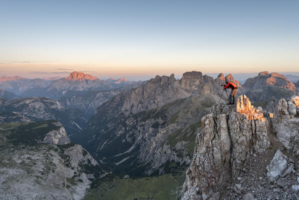 Sesto / Sexten, province of Bolzano, Dolomites, South Tyrol, Italy.  A photographer photographed the sunrise at the Three Peaks of Lavaredo