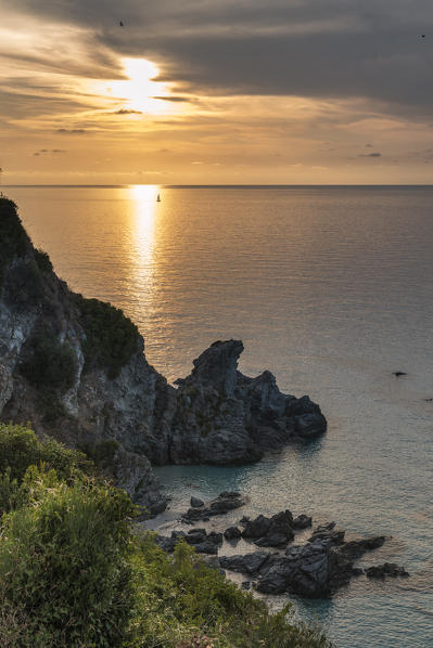 Zambrone, province of Vibo Valentia, Calabria, Italy, Europe. Sunset on the beach of Lion's rock