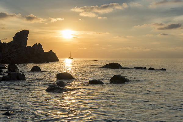 Zambrone, province of Vibo Valentia, Calabria, Italy, Europe. Sunset on the beach Lion's rock