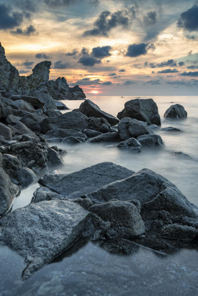 Zambrone, province of Vibo Valentia, Calabria, Italy, Europe. Sunset on the beach of Lion's rock