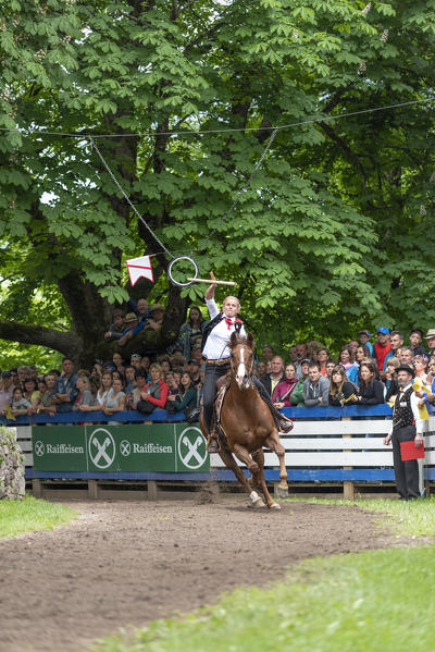 Castelrotto / Kastelruth, South Tyrol, Italy. The traditional ring jousting at the Mount Calvario in Castelrotto 